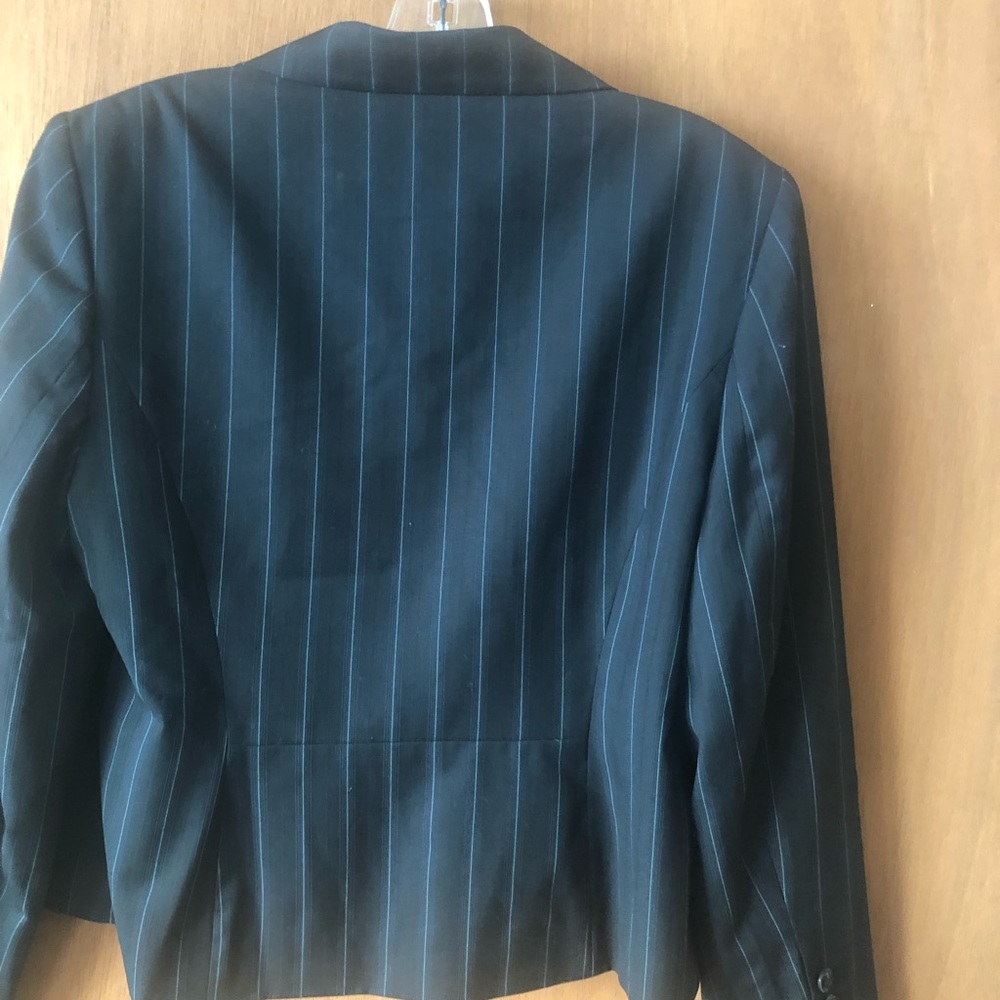 2 button blazer type black or very dark navy with pin stripes and 2 patch pocket